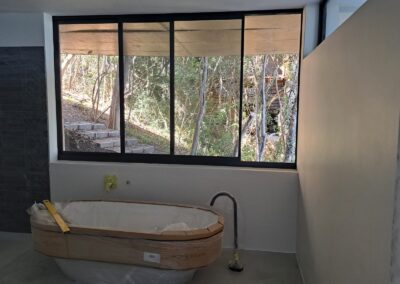 Sliding windows installation in a modern bathroom completed